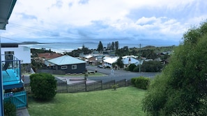 A residential area with houses, a clear sky, and a view of the sea. - Clareview, 8 Korogora Street (Crescent Head)