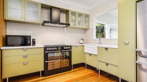 A kitchen with a microwave, stove, oven, and a sink. - Ondine, 4 Belmore Street (CRESCENT HEAD)
