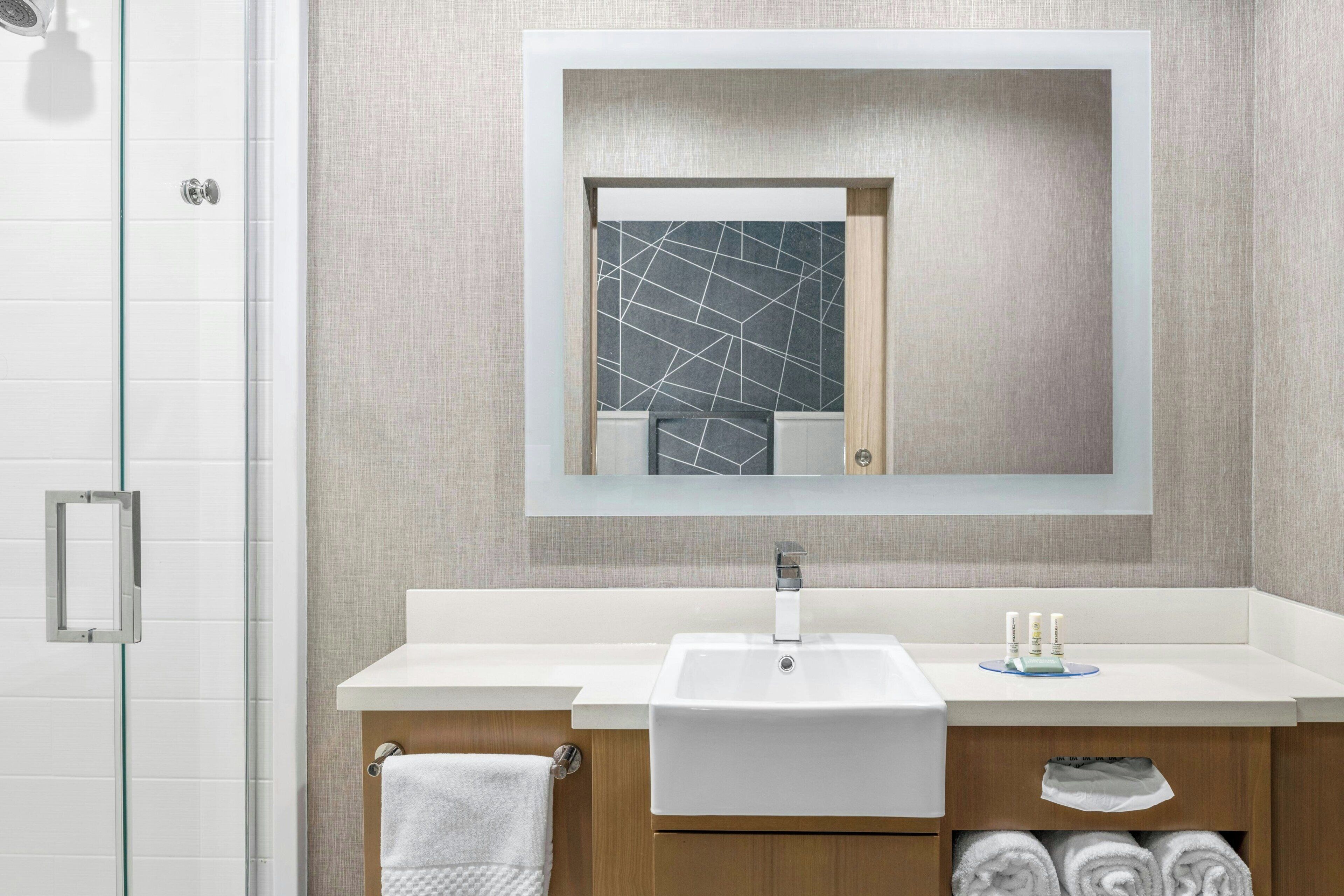 suite, 2 queen beds | bathroom | hair dryer, towels, soap, shampoo