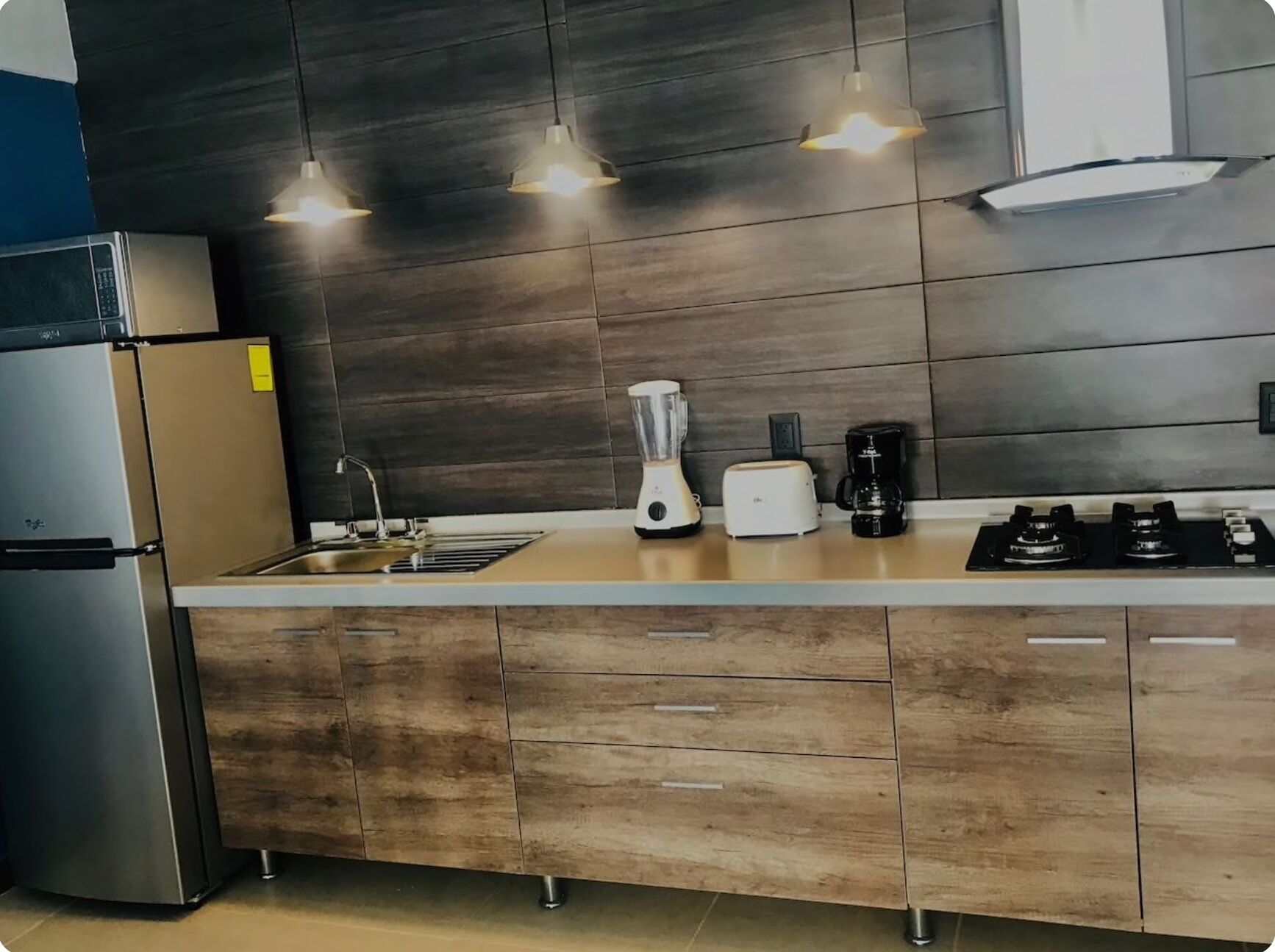 Fridge, microwave, stovetop, coffee/tea maker