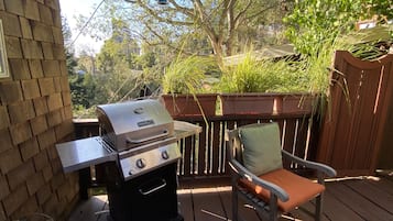 Relax and dine al fresco on the deck, where a grill and single chair invite you to unwind.