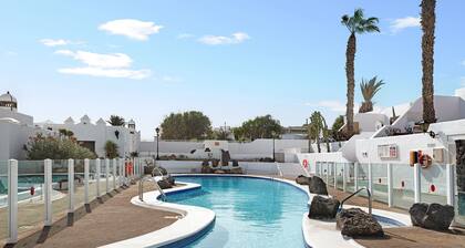 Front-Line Holiday Bungalow "Puerto Chico T" with Mountain & Sea Views, Shared Pool & WiFi