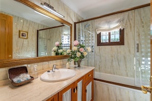 Bathtub, hair dryer, towels