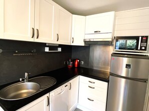 Fridge, microwave, dishwasher, coffee/tea maker