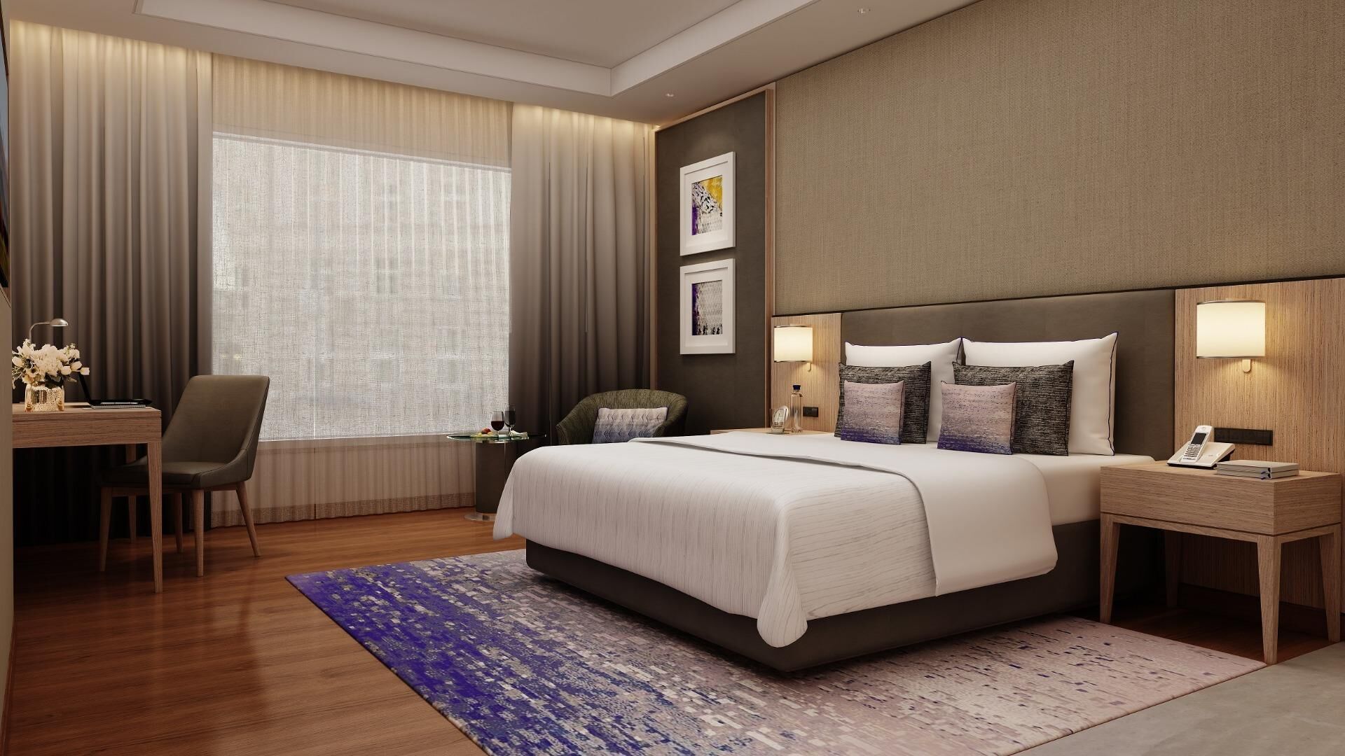 A modern hotel room with a large bed, a desk with a chair, a bedside table with a lamp, and a large window with curtains.