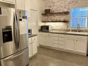 Microwave, dishwasher, coffee/tea maker, cookware/dishes/utensils