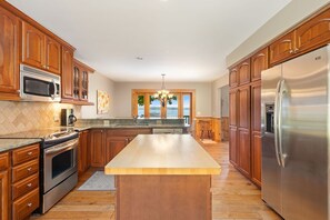 Fridge, microwave, oven, stovetop - Lakefront Torch Lake Home - Cottage Feel w/ 5 BR and Over 4K Sq Ft, Private Dock (Kewadin)