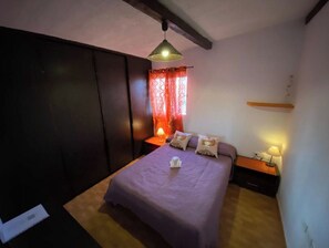 Relax in this inviting space with a large bed and comfortable seating area.