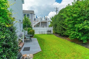 A backyard with a patio, outdoor furniture, and a grill. - Sunrise Bay View Vibes   • 4BR/2.5BA • Walk to Harpoon Hanna’s • 1 Mile to Beach (Selbyville)