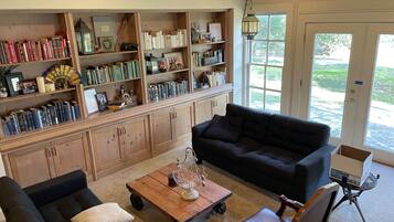 Smart TV, fireplace, books, printers