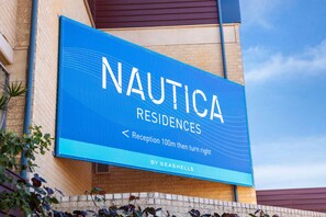A large sign for Nautica Residences with directional instructions for the reception. - Nautica Residences Hillarys (Hillarys)