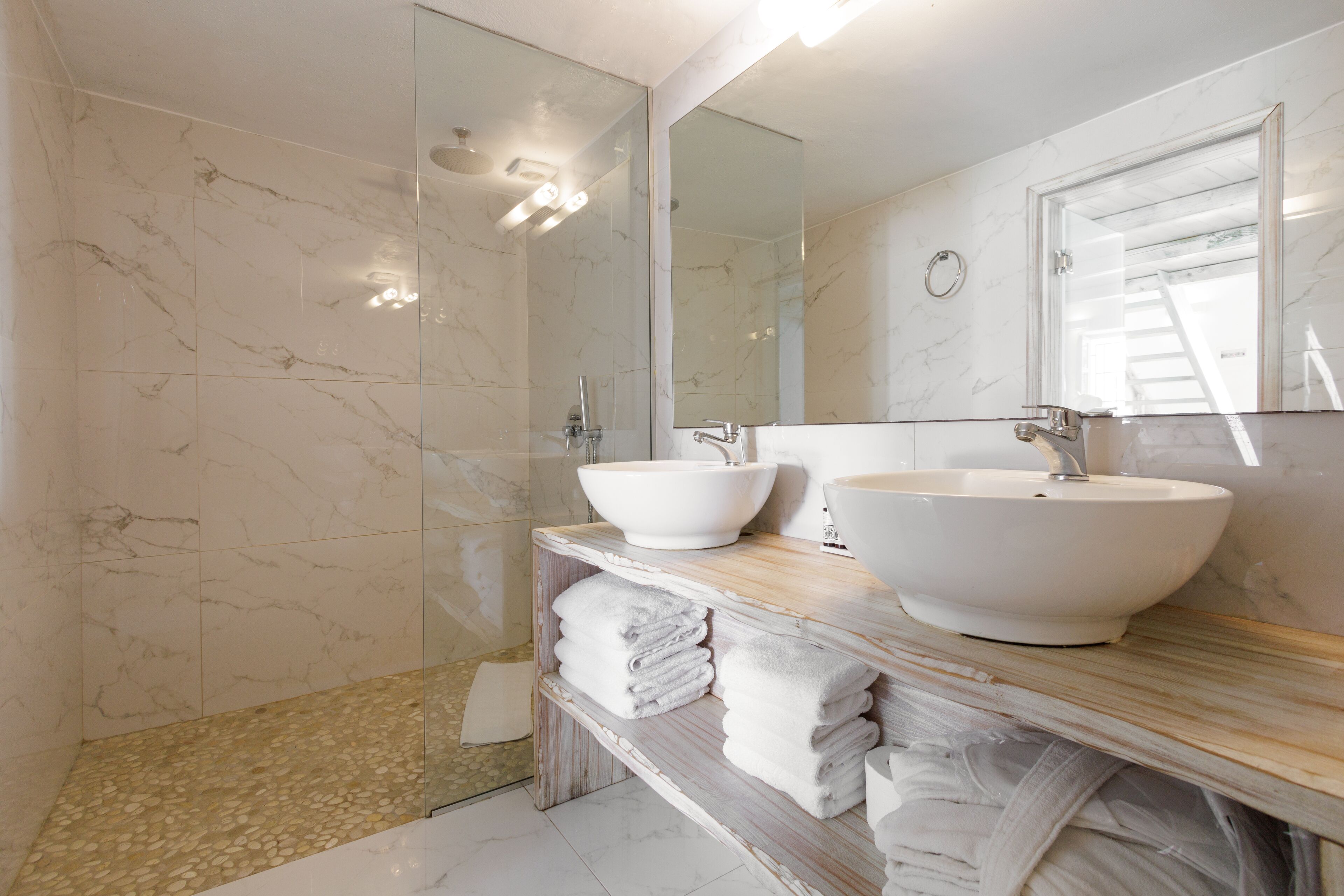 deluxe pool suite | bathroom | shower, slippers, towels, soap