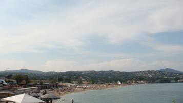 On the beach, sun-loungers