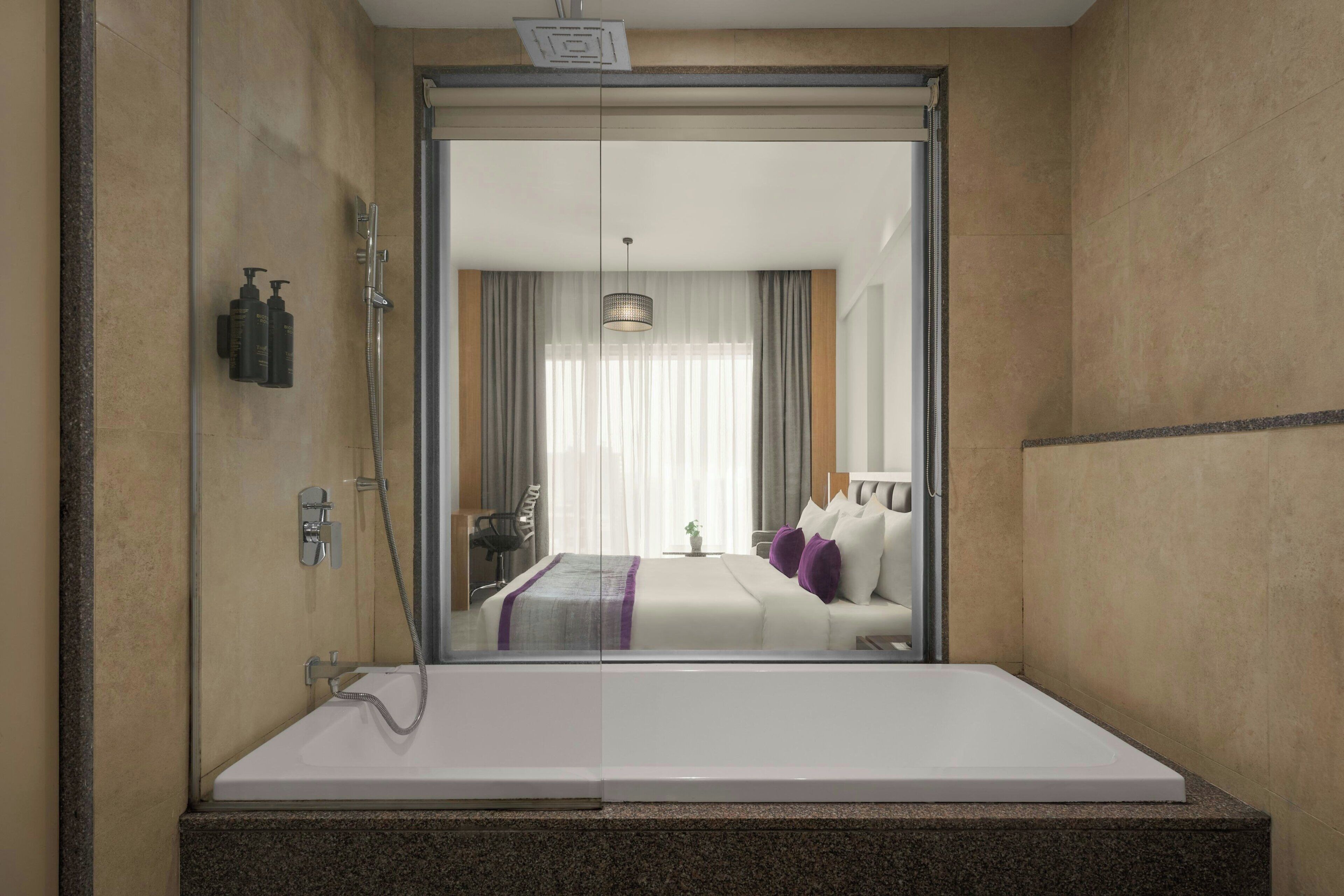 A modern bathroom with a large mirror, a shower, and a bathtub.