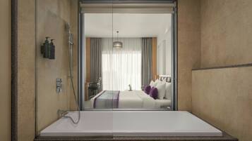 Un baño moderno con un espejo grande, una ducha y una bañera.