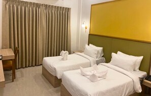 Deluxe Room | 1 bedroom, in-room safe, individually decorated, individually furnished
