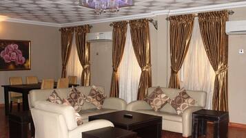 Presidential Suite | Living area | 75-inch Smart TV with satellite channels, TV, heated floors