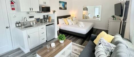 1 bedroom, desk, iron/ironing board, travel crib