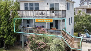 A two-story house with a balcony, a sign reading "Your Space", and a number "400" on the side.