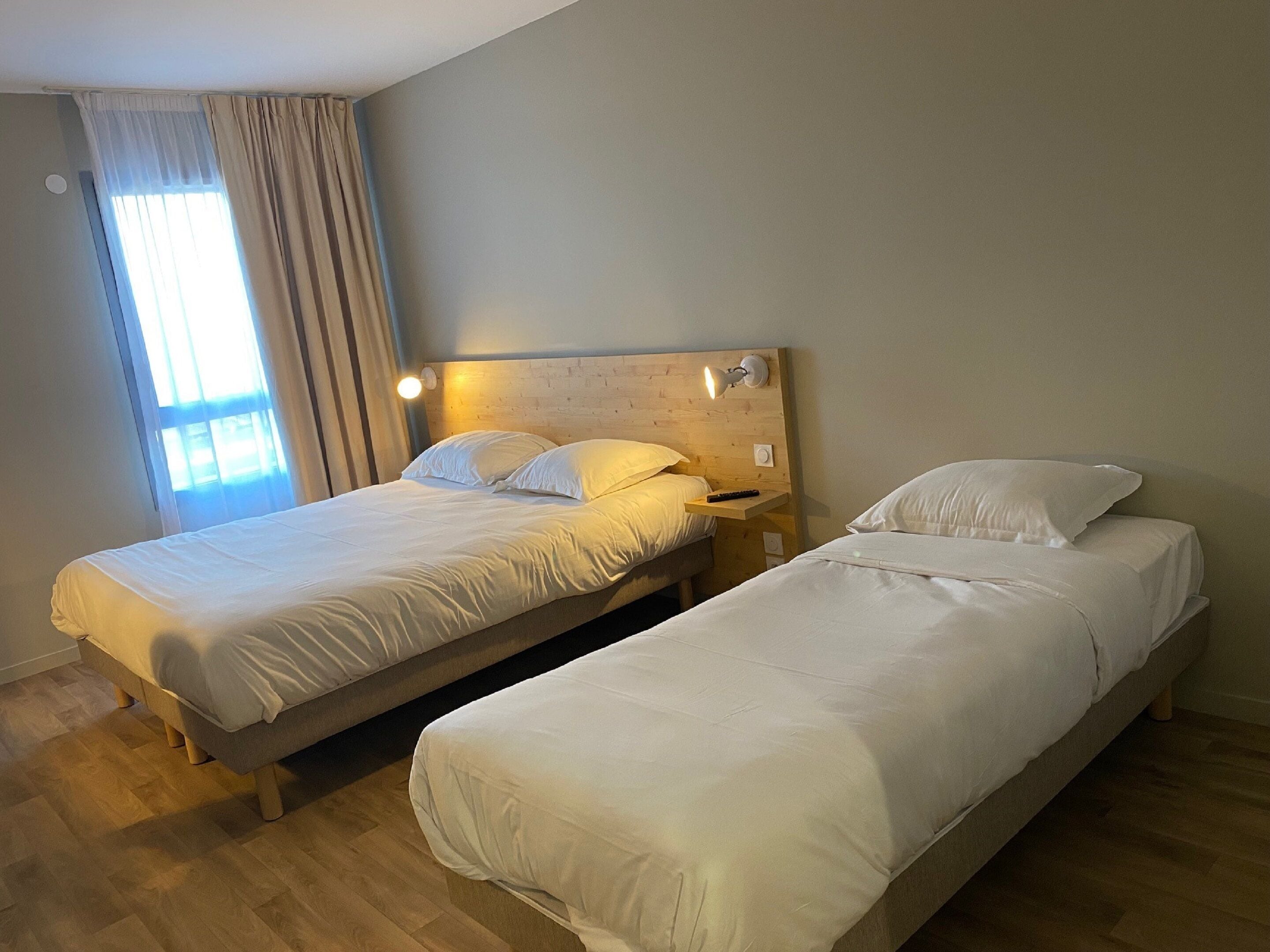 family quadruple room | premium bedding, desk, laptop workspace, soundproofing