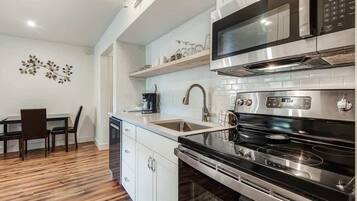 Coffee/tea maker, fridge, microwave, oven