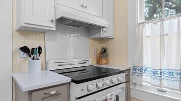 Fridge, microwave, coffee/tea maker, cookware/dishes/utensils