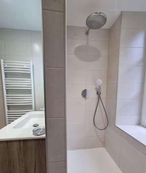 Bathtub, hair dryer, towels, soap