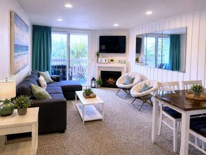 TV, fireplace - SolMar Breeze · 1BR Resort, Heated Pools, Hot Tubs, Steps to Beach, Pier, Harbor (Oceanside)