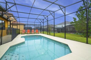 A heated pool, sun loungers