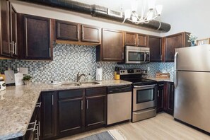 Fridge, microwave, oven, stovetop - Sanctuary Co Loft in Downtown Johnson City (Johnson City)