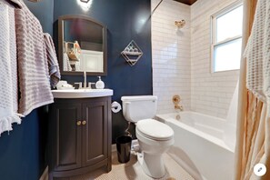 Combined shower/tub, hair dryer, towels, soap