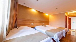 A hotel room with two beds, wooden headboard, and a wooden floor. - Greentree Inn Chongqing Longhushidai Tianjie Xietaizi Subway Station H (Chongqing)