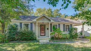A single-story house with a front porch, a small front yard, and a mailbox. - Your Home away from Home in Memphis, Tn. Minutes from all Memphis attractions (Memphis)