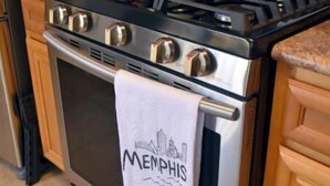 A kitchen with a stainless steel stove, oven, and a white towel hanging on the oven door with "Memphis" written on it. - Your Home away from Home in Memphis, Tn. Minutes from all Memphis attractions (Memphis)