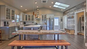 A modern kitchen with a central island, built-in cabinets, and a skylight. - ‘Sierra Sunset Inn’ - 3 Miles to Placerville! (Diamond Springs)