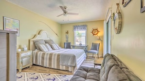 A bedroom with a bed, a chair, a couch, a desk, and a ceiling fan. - Steps to Lake of the Ozarks: Family Home w/ Views! (Camdenton)