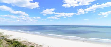 A beach with clear skies and calm waters.