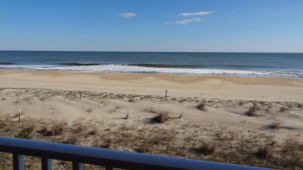 A beach with a clear sky and ocean waves. - Barefoot Country 304-Oceanfront 138th St, WIFI, Elev, W/D, AC (Ocean City)