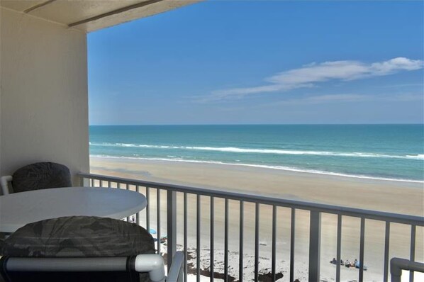 A balcony with a view of a beach and ocean. - Perfect Location in Ponce Inlet for this 2/2 oceanfront Condo 504 South Point (Ponce Inlet)