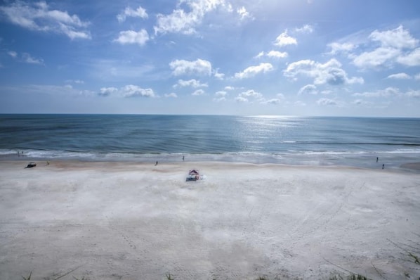 A beach with a clear sky and calm sea. - 7th Floor Unit 709 Oceanfront with Great Views in Ponce Inlet (Ponce Inlet)