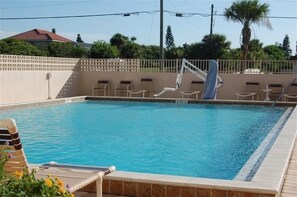 A rectangular swimming pool with a clear blue water surface, surrounded by a tiled deck. - 7th Floor Unit 709 Oceanfront with Great Views in Ponce Inlet (Ponce Inlet)