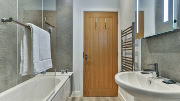 Bathtub, hair dryer, towels, soap