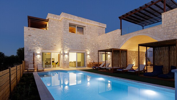 A modern house with a swimming pool, stone exterior, and outdoor seating area. - Mandana Villa - With Private Pool & Jacuzzi (Pigi)