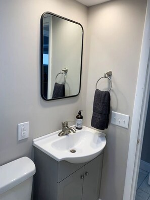 Combined shower/tub, hair dryer, towels, soap