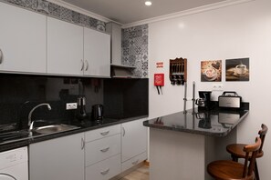 Fridge, microwave, stovetop, coffee/tea maker