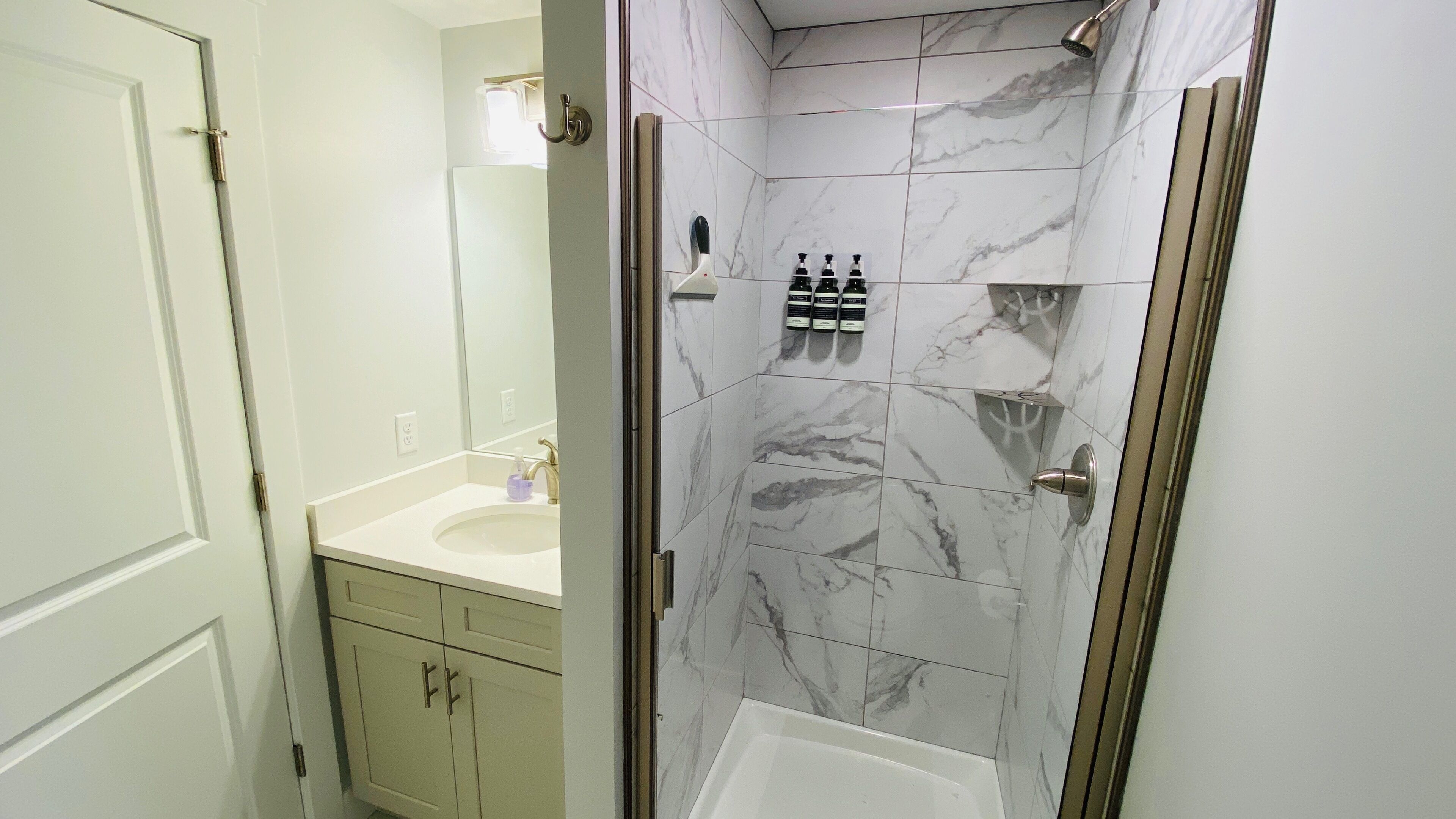 Combined shower/tub, hair dryer, towels, soap
