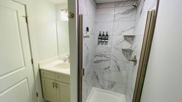 Combined shower/tub, hair dryer, towels, soap