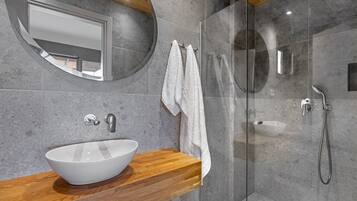 Shower, hair dryer, towels, toilet paper