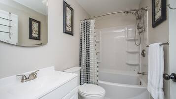 Bathtub, towels, soap, shampoo