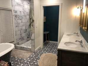 Bathtub, hair dryer, towels, soap